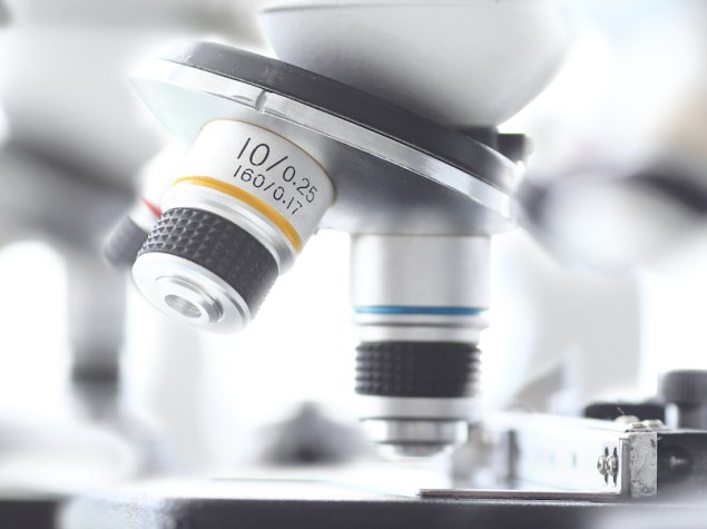 Set of microscopes standing in row in school chemist classroom