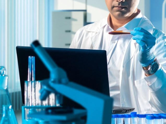 Man infectologist checks persons blood.